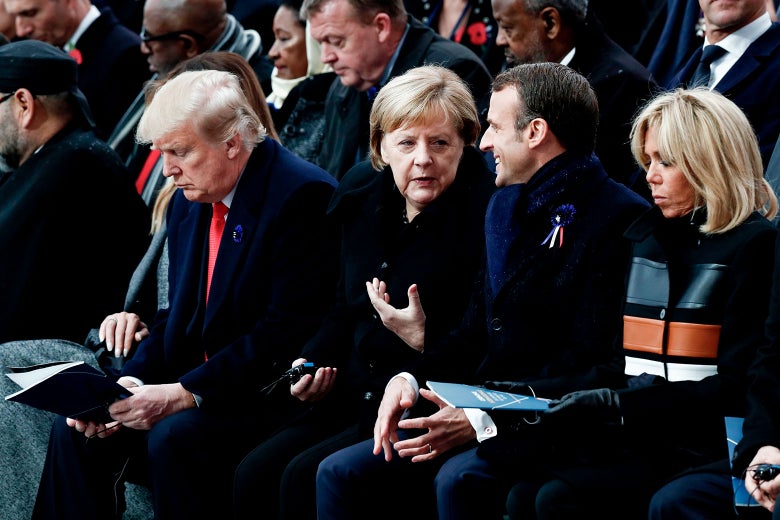 U.S. President Donald Trump, German Chancellor Angela Merkel, French President Emmanuel Macron, and his wife Brigitte Macron attend a ceremony at the Arc de Triomphe in Paris on Sunday.